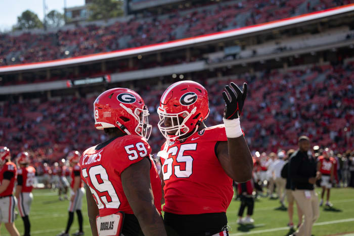 OTs Broderick Jones and Amarius Mims